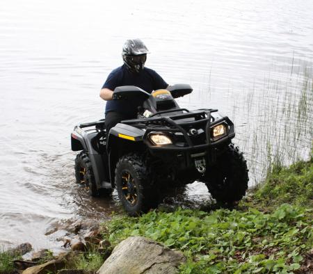 Brush guards on all four wheels help protect the Outlander from rocks and debris.