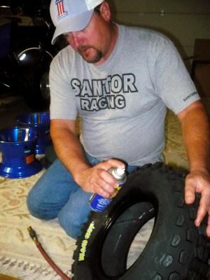 There are a couple of options you have when lubing up the center of the tire to slip the wheel into place. You can use a mixture of soap and water or you can just go with the Jack-of-all-trades WD40