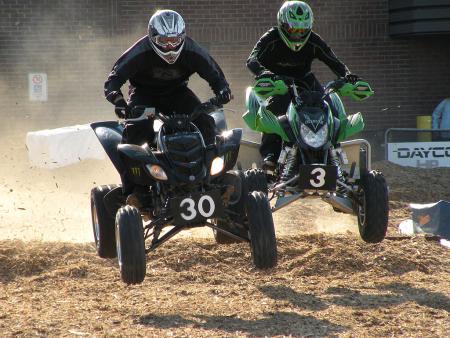 The sport quad racers burned up the mulch track.